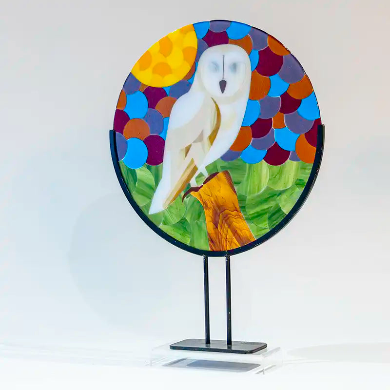 Barn owl made of glass on stand